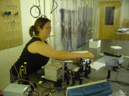 Sarah aligns the laser.